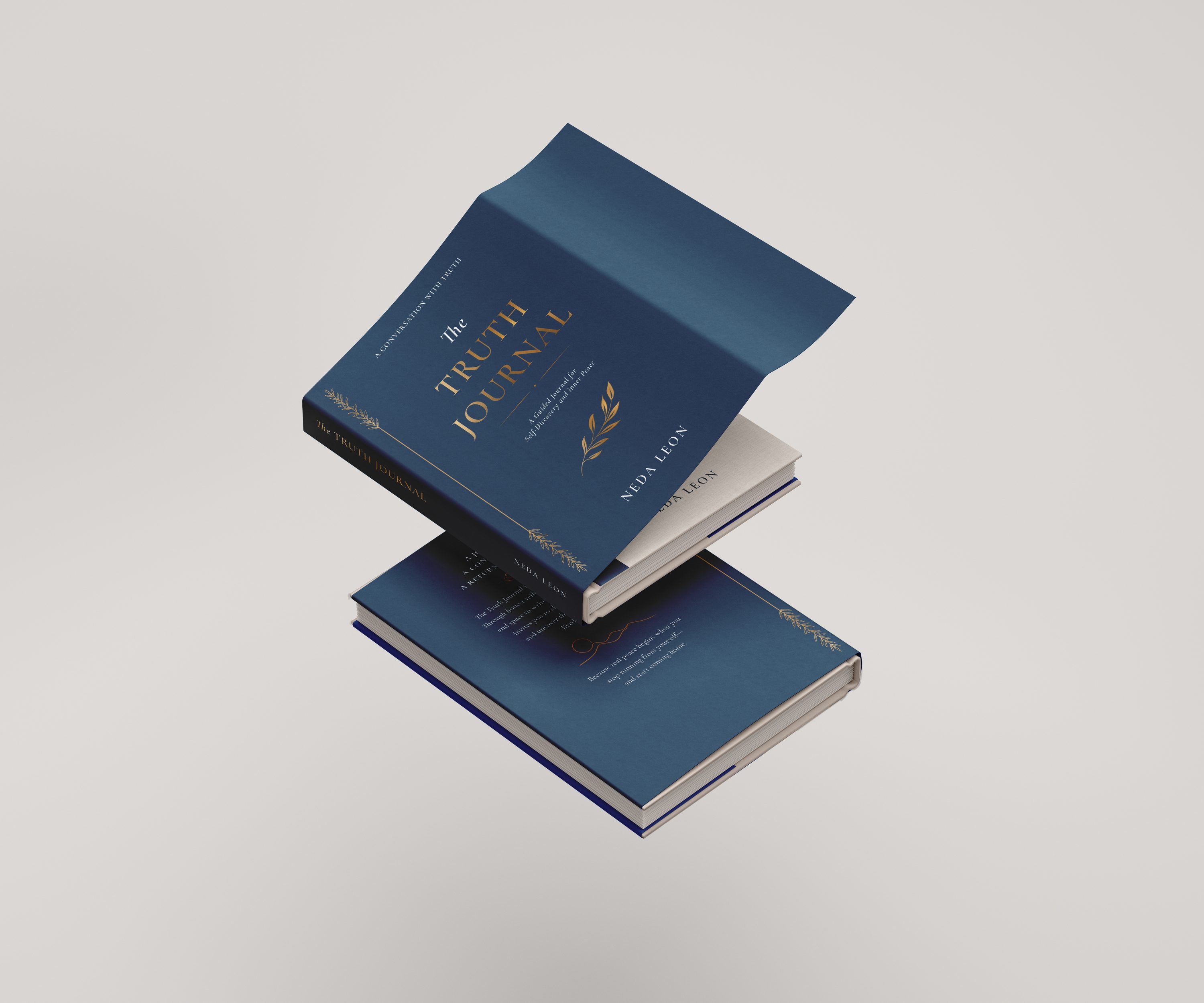 Two hardcover copies, one open, showing the cover and spine